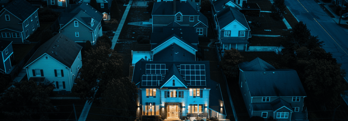 Close-up of residential solar panels under dramatic storm clouds in Pennsylvania, representing storm season readiness with Canopy Solar battery backup